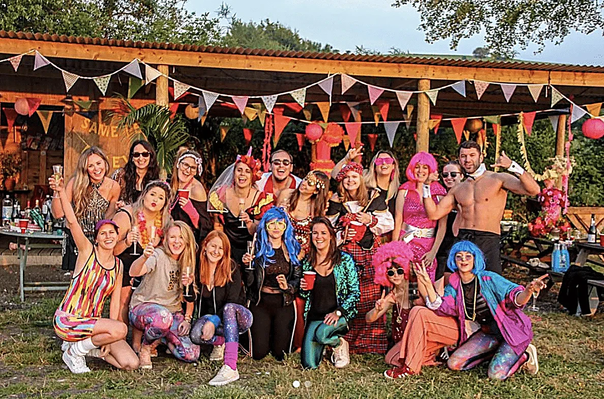 Hen party group outside the shelter at Chalke Valley glamping