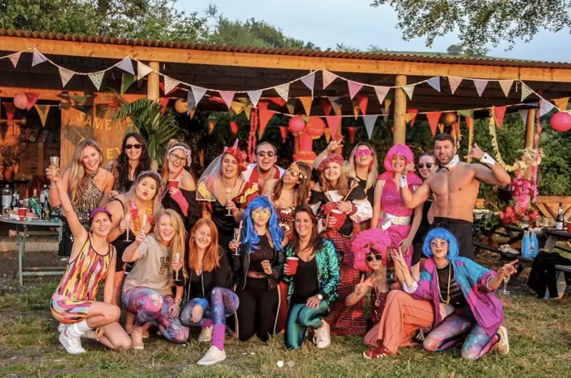 Hen party group outside the shelter at Chalke Valley glamping