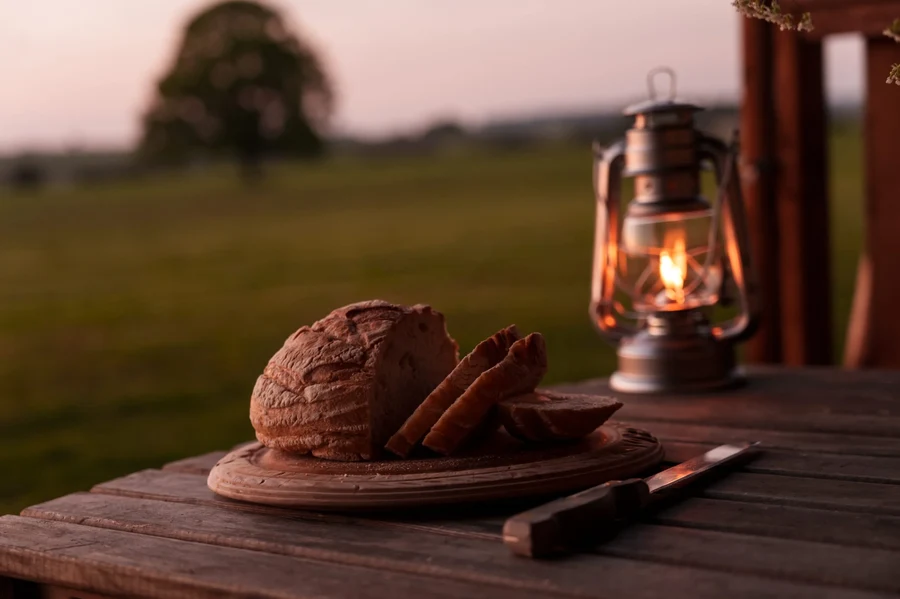 Bread and lanterns with blurred oak tree in the background
